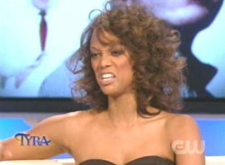 Illustration for article titled Tyra Unveils Real Hair; Interviews Evil Leprechaun